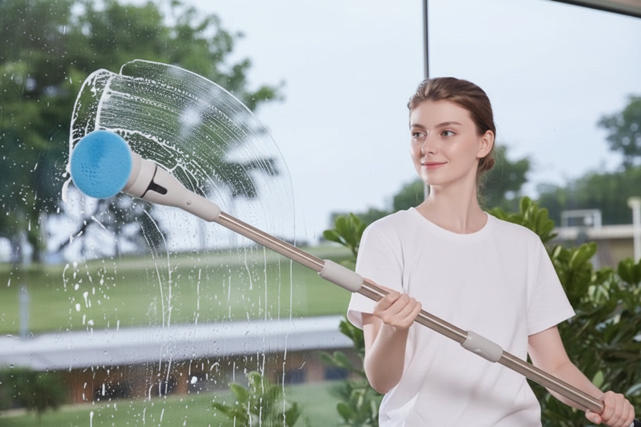 Woman holding a cleaning tool with a blue head, outdoors.